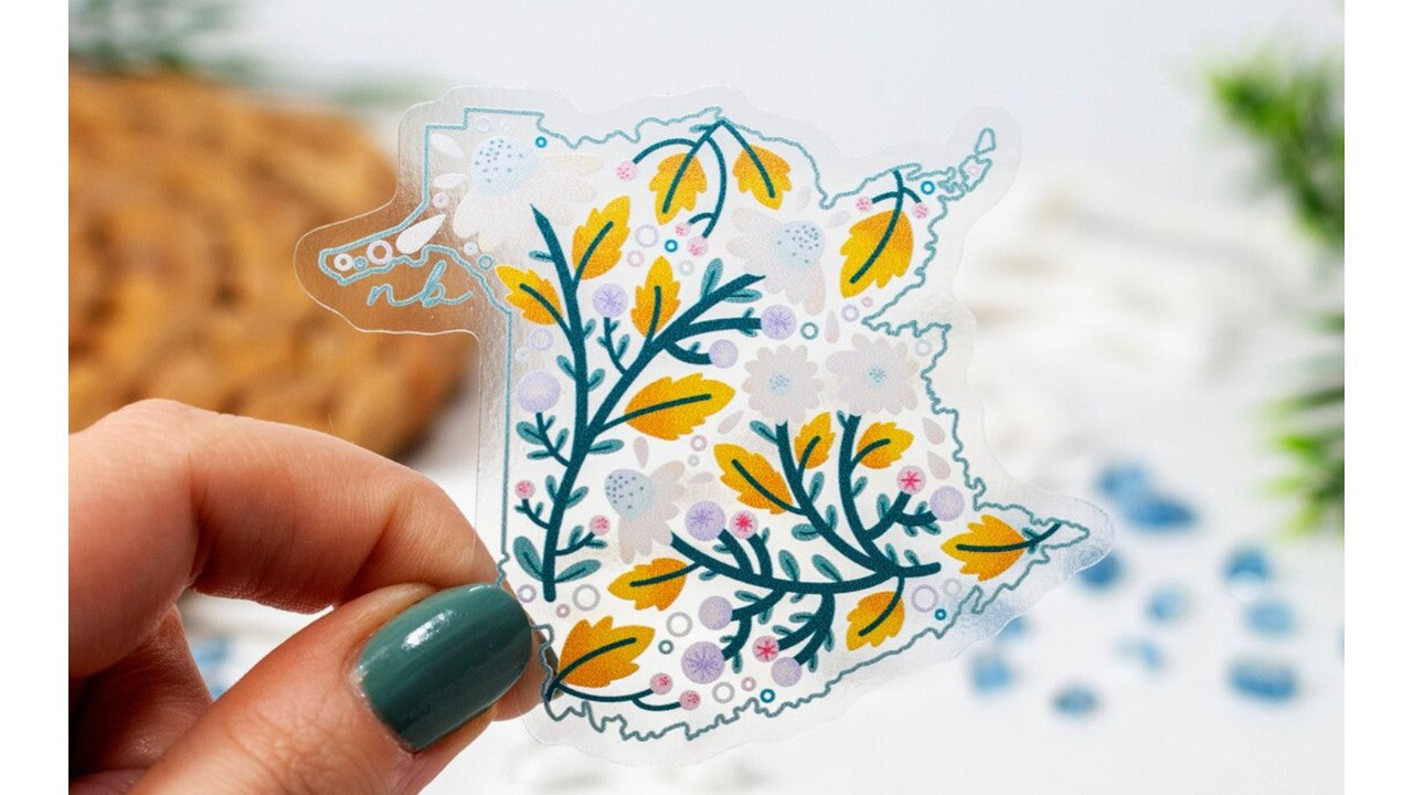 Printed Vinyl Sticker featuring an original illustration of the outline of the province of New Brunswick filled with leaves and flowers.
