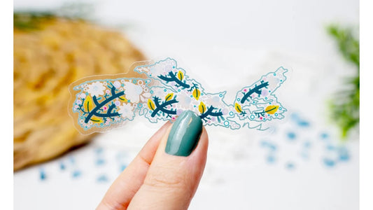 ﻿Printed Vinyl Sticker featuring an original illustration of the outline of province of Nova Scotia filled with leaves and flowers. 